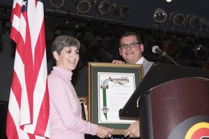 God's Bread Box accepts proclamation from Assemblyman Rudy Salas.